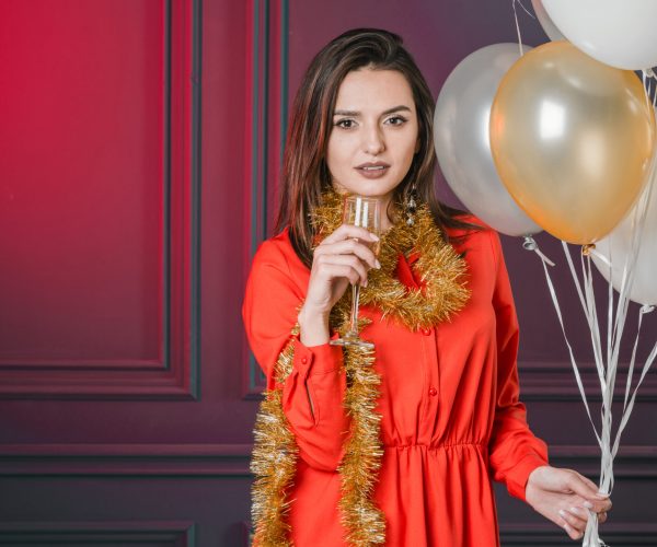 girl-offering-champagne-with-balloons
