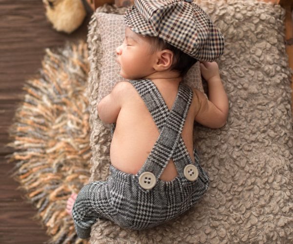 newborn-infant-little-pretty-baby-boy-laying-wooden-bed-baby-suit-hat