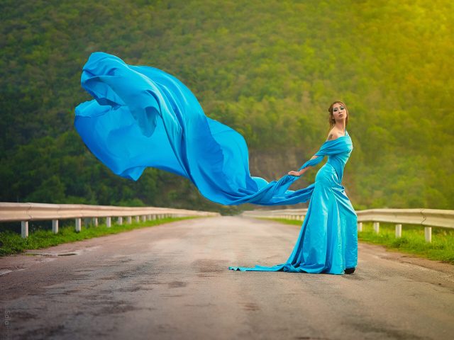portrait-woman-blue-dress-standing-road